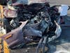 Police say the crash, on Woodbourne Road, caused "catastrophic" damage to both vehicles.