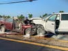 Police say the crash, on Woodbourne Road, caused "catastrophic" damage to both vehicles.