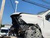 Police say the crash, on Woodbourne Road, caused "catastrophic" damage to both vehicles.