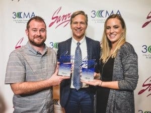 Communications and Marketing staff Austin Ellington, Will Hampton and Sara Bustilloz hold Round Rock’s first place awards earned at 3CMA on Sept. 5.