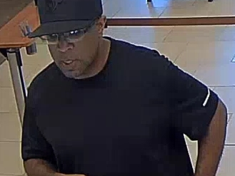 Police released a surveillance camera image of the suspect in a bank robbery that occurred Friday, Oct. 4, 2019.