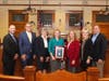 Flanked by county officials, Sherry Golden was honored for outstanding service on behalf of veterans. 