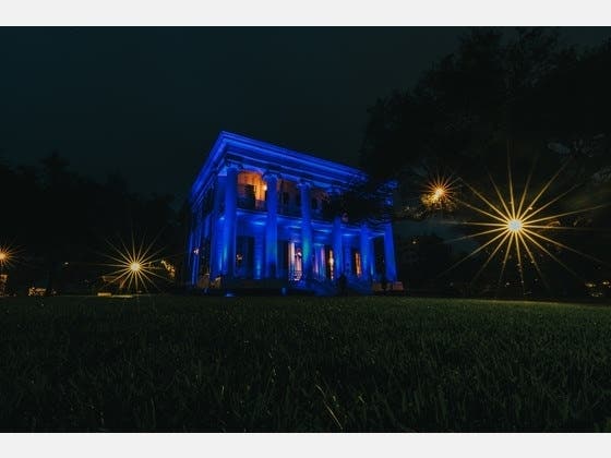 The Texas governor's mansion was bathed in blue light on Saturday in tribute to health care workers battling against coronavirus.