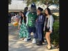 Photo caption: Maverick celebrates with a graduate and his family at SCF’s Spring 2026 grad walk ceremony at SCF Venice.