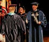 Photo caption: Patricia Rand, Ph.D., vice president, academic affairs, SCF, and Tommy Gregory, J.D., president, SCF, congratulate a graduate at SCF’s Spring 2026 graduation ceremony at SCF Bradenton.
 