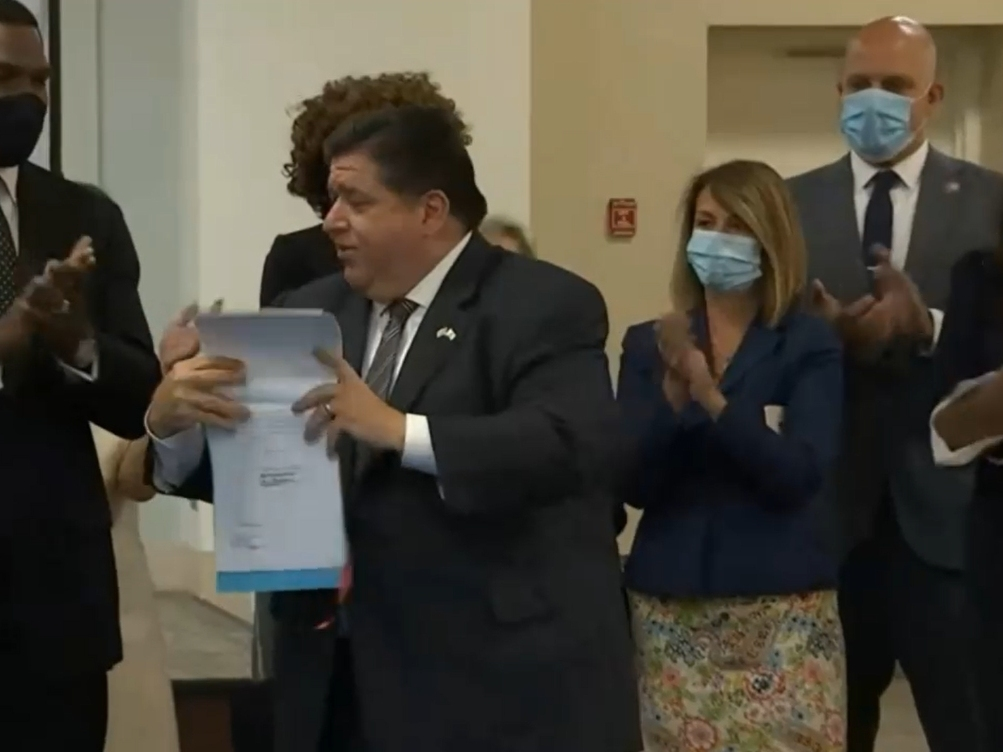 From left to right: State Sen. Napoleon Harris, Gov. JB Pritzker, State Rep. Deb Conroy and State Rep. Chris Bos.