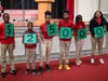 How much is the cash prize that accompanies the Milken Educator Award? One digit at a time, students hold up cards representing the amount of the Award. When the final zero appears, the room starts to hum. That makes $25,000!