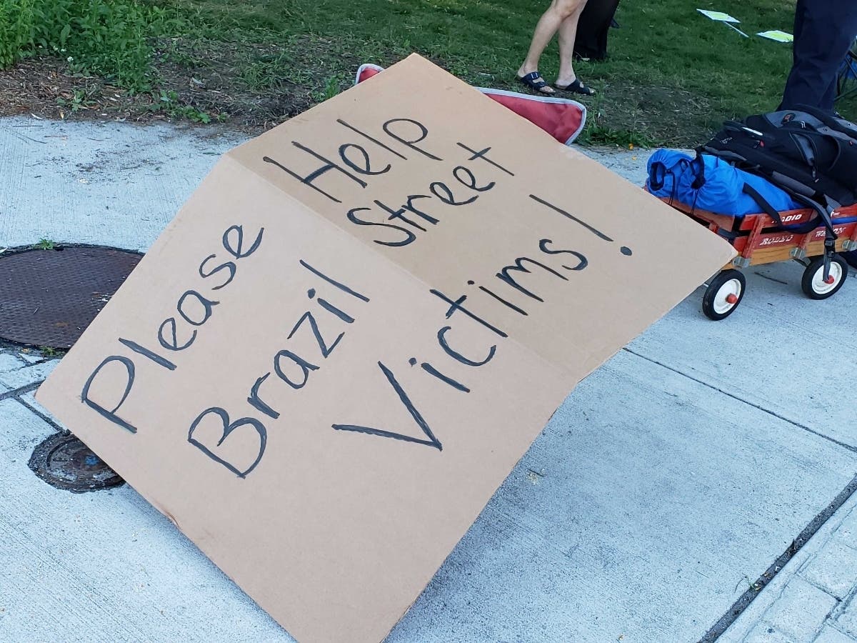 A sign at a fundraiser for Brazil Street residents echoed what neighbors farther up the street wanted to see more of.