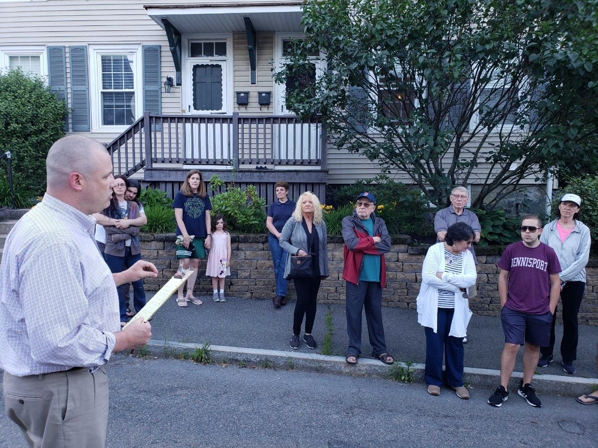 Ward 5 Alderman Shawn MacMaster (left) speaks with residents of Brazil Street upset with the city's response.
