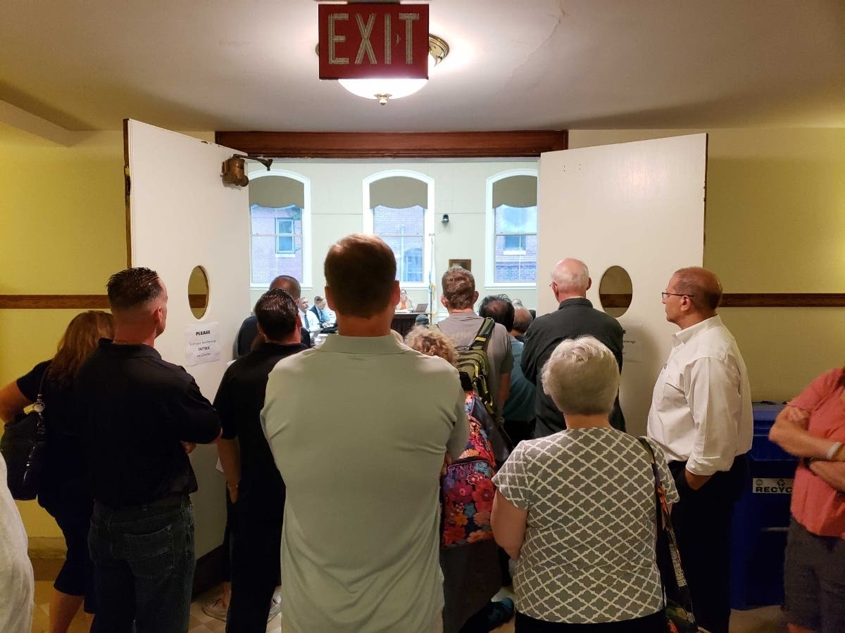 The crowd who showed up Thursday night spilled out of the aldermanic chambers.