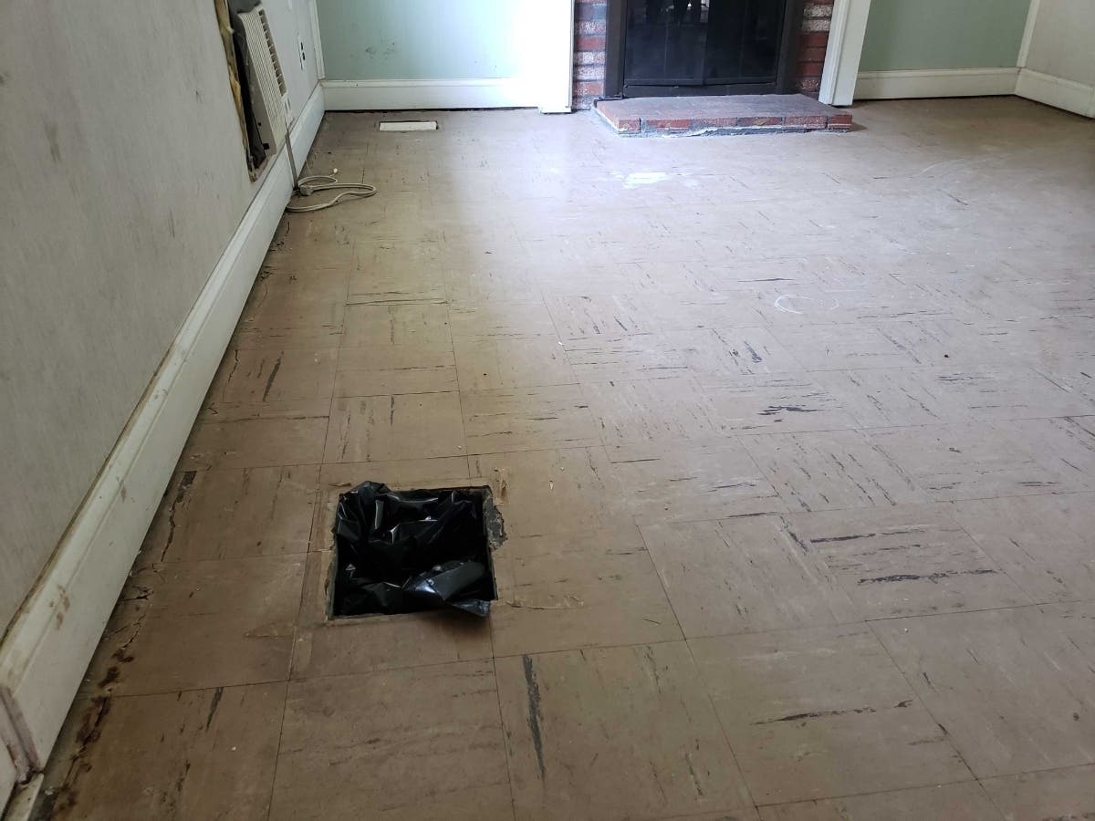 12 Brazil St. was cleared to live in - until the Health Director found out there was sewage in a heating and cooling unit beneath this floor.