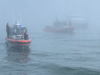 A passenger photographed boats coming to the aide of the Lightning, which ran aground in Boston Harbor.