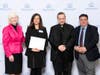 Foundations in Education Executive Director Holly Doherty-Lemoine, Bishop Frank J. Caggiano and Superintendent of Schools Dr. Steven Cheeseman present Melissa Warner the award.