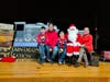 Left to right: Benjamin (K) and Valentino Valdez (Gr. 2), and their parents, visit Santa.