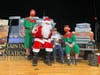 Left to right: TJ Lebski (PreK-4) visits with Santa and his elves. 