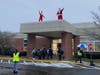 Peppermint Sparkle (aka St. Mark Principal) and Santa greet students as they arrive to school.