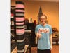 Brandon standing next to over 150 face shield holders