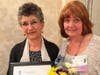 SIIR Past President Patti Cullen (right) poses with Fayrouz Azer of Diakon Lutheran Ministries, winner of the Organization Advancing the Status of Women Award.