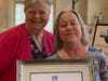 Marguerite Brambani accepts the Partner of the Year Award for Jack Lyons, owner of Neshaminy Electrical Contractors, Inc., from Gina Fuscellaro, SIIR fundraising chair.