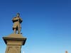 Two plaques recognizing Confederate soldiers sit at the base of a Union soldier statue.