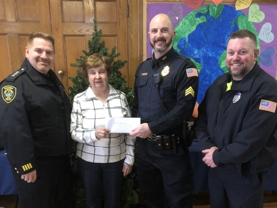  From left: Deputy Chief of Police David Clark, Reading Food Pantry Coordinator Phyllis Maxwell, Sgt. Chris Jones, Traffic and Safety Officer Mike Scouten.