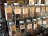 The store contains bottles of items originally sold at the store, such as flaxseeds and hemlocks.