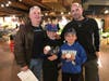 L to R: Wayne Zola, Jonathan Davis, Kevin Davis and Andrew Davis show off their signed memorabilia at Stew Leonard's.