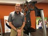 Stephan Rigopoulos, owner and studio manager of The Exercise Coach in Cos Cob, stands by his gym's equipment on Aug. 14, 2019.