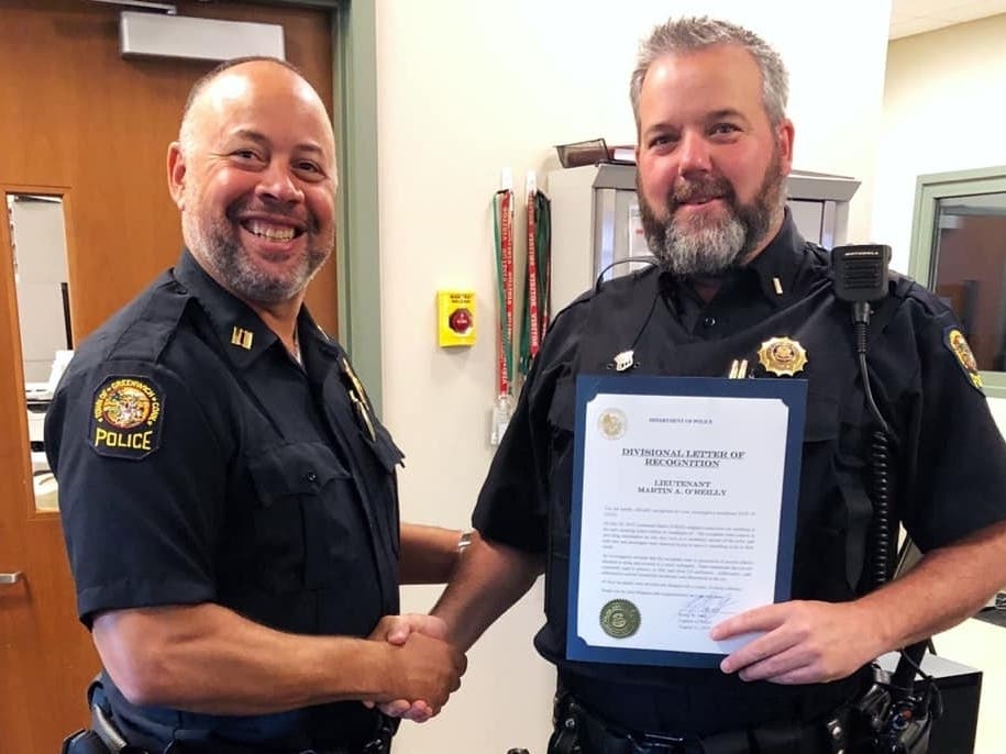Lieutenant Martin O'Reilly (R) ​received a letter of recognition on Aug. 16, 2019 for his role in the arrest of several "mail fishing" suspects
