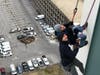 New York Yankees General Manager Brian Cashman rappels down the Landmark Building in Stamford with Jason Teitelbaum on Dec. 6, 2019.