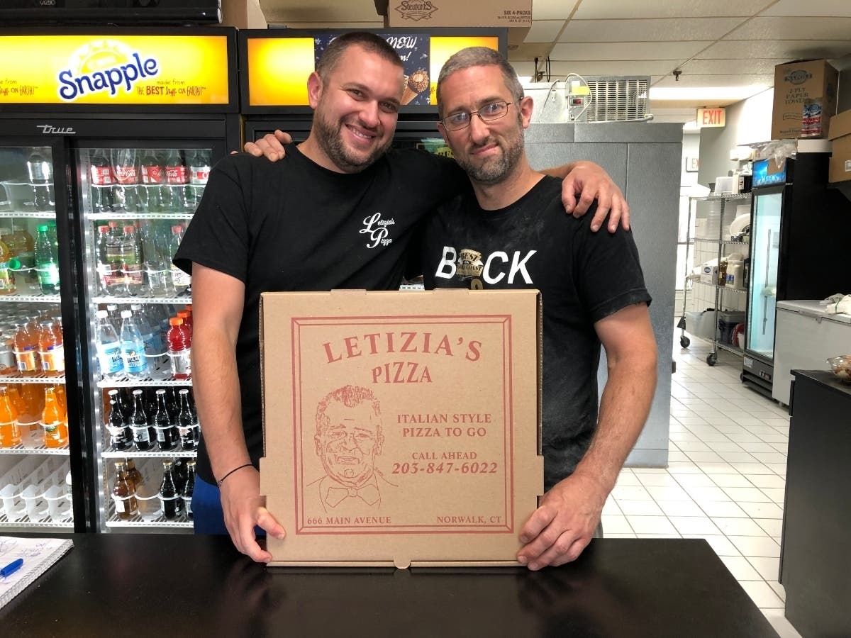 (L-R) Danny Segers and Dave Cook, along with Dennis Letizia, are the three owners of Letizia's Pizza on Main Avenue in Norwalk. The pizzeria hopes to thrive after temporarily moving to strictly take out on March 16, 2020.