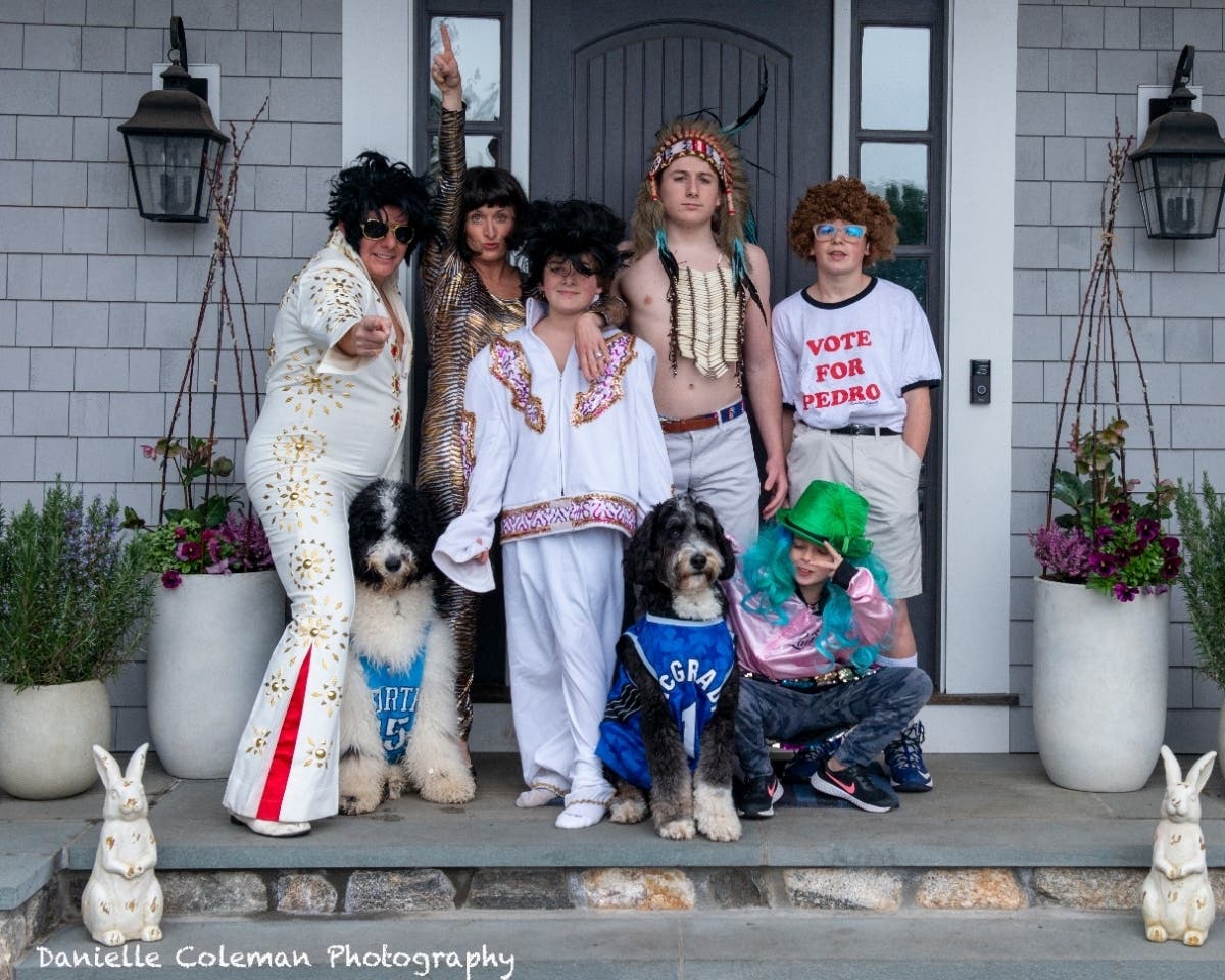 A Greenwich woman has been taking photographs of families on their front steps as part of a project designed to raise money for hospitals.