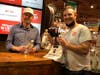Bryan Cranston and customer Tom Morsanutto at Stew Leonard's Wines & Spirits of Norwalk, where the actor signed bottles of Dos Hombres mezcal on Monday.