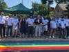 Mayor Harry Rilling, State Rep. Lucy Dathan and others gather for a ribbon cutting and unveiling of a new rainbow crosswalk in Norwalk on Tuesday.