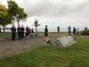Gov. Ned Lamont, Lt. Gov. Susan Bysiewicz and other watch as flowers are placed on the 9/11 monument at Sherwood Island State Park in Westport following the state's annual memorial ceremony Thursday.