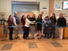 First Selectman Monica McNally and others cut the ribbon during the grand opening of The Café at Darien Librar​y on Wednesday.