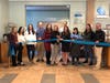 First Selectman Monica McNally and others cut the ribbon during the grand opening of The Café at Darien Librar​y on Wednesday.