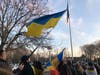 Members of the Norwalk community stand in solidarity with Ukraine during a vigil held Wednesday outside City Hall.