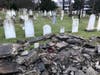 The damaged stone wall alongside St. Paul's on the Green Episcopal church's historic cemetery on East Avenue in Norwalk on Sunday, April 3, 2022.