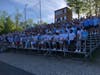 Students stand reverently during a lacrosse game at Shelton High School honoring the life of Jimmy McGrath, 17, a Fairfield Prep student who was fatally stabbed late Saturday.