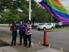 City officials raise the Pride flag outside City Hall during a ceremony held Thursday afternoon.