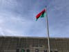 The Pan-African flag is raised Tuesday afternoon in front of the Norwalk Heritage Wall.