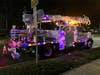 A TTD bucket truck covered in holiday lights delivers Santa to the tree lighting event Monday night in East Norwalk.