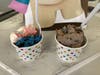 Cups of Swamp, Cookie Monster and Strawberry Cheesecake flavors of ice cream at Sweet Ashley's in Norwalk on March 29, 2023.
