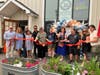 Mayor Barbara Smyth, owners Luis and Kristen Solis and others cut a ribbon during a 30-year anniversary celebration at Norwalk Pizza & Pasta, located at 13 Winfield Street in Norwalk, on July 16, 2026.