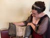 Katy Bishop showing a historic garmet