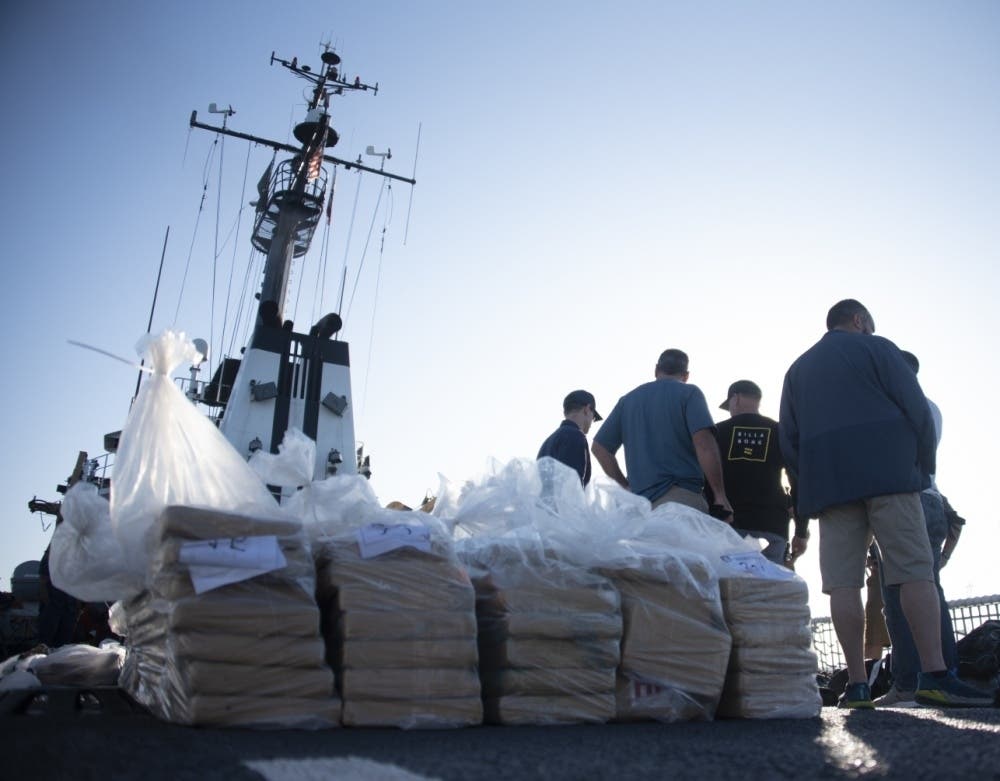 Coast Guardsmen prepare bails of cocaine to be offloaded from the Coast Guard Cutter Alert in San Diego, October 16, 2019. The crew aboard the Alert offloaded approximately 6,800 pounds of cocaine.