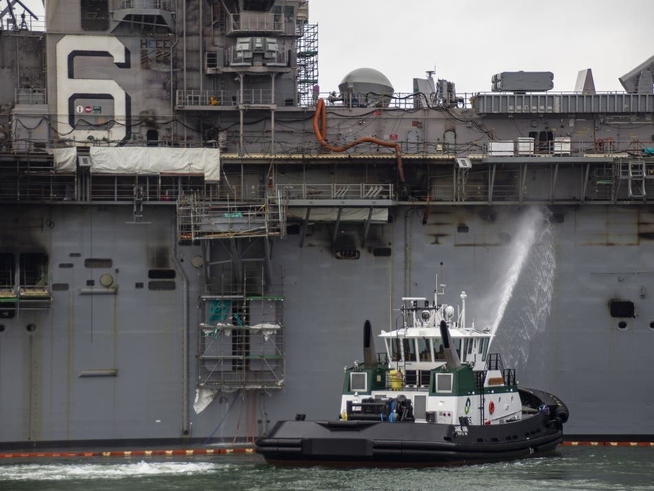 SAN DIEGO (July 14, 2020) Sailors and Federal Firefighters combat a fire onboard the amphibious assault ship USS Bonhomme Richard (LHD 6).