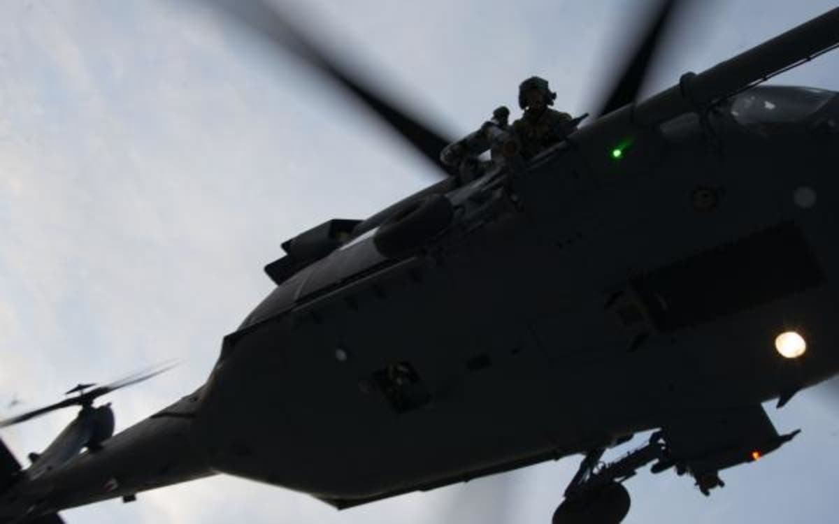 A rescue helicopter, like this one, was called in because the surf was too treacherous. (file photo)