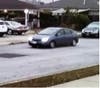 Surveillance photo of the suspect's car, a blue Toyota Prius.
